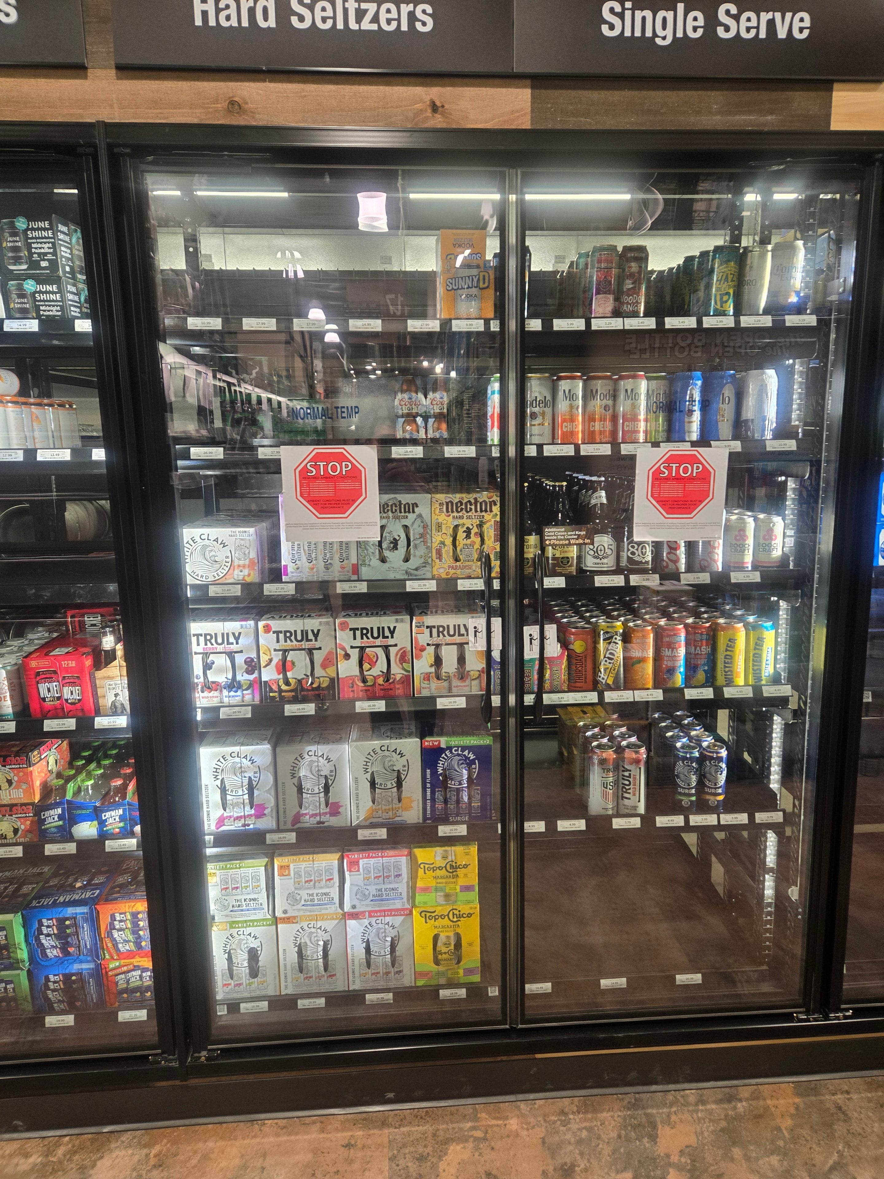 Finished commercial display case with beverages fully stocked