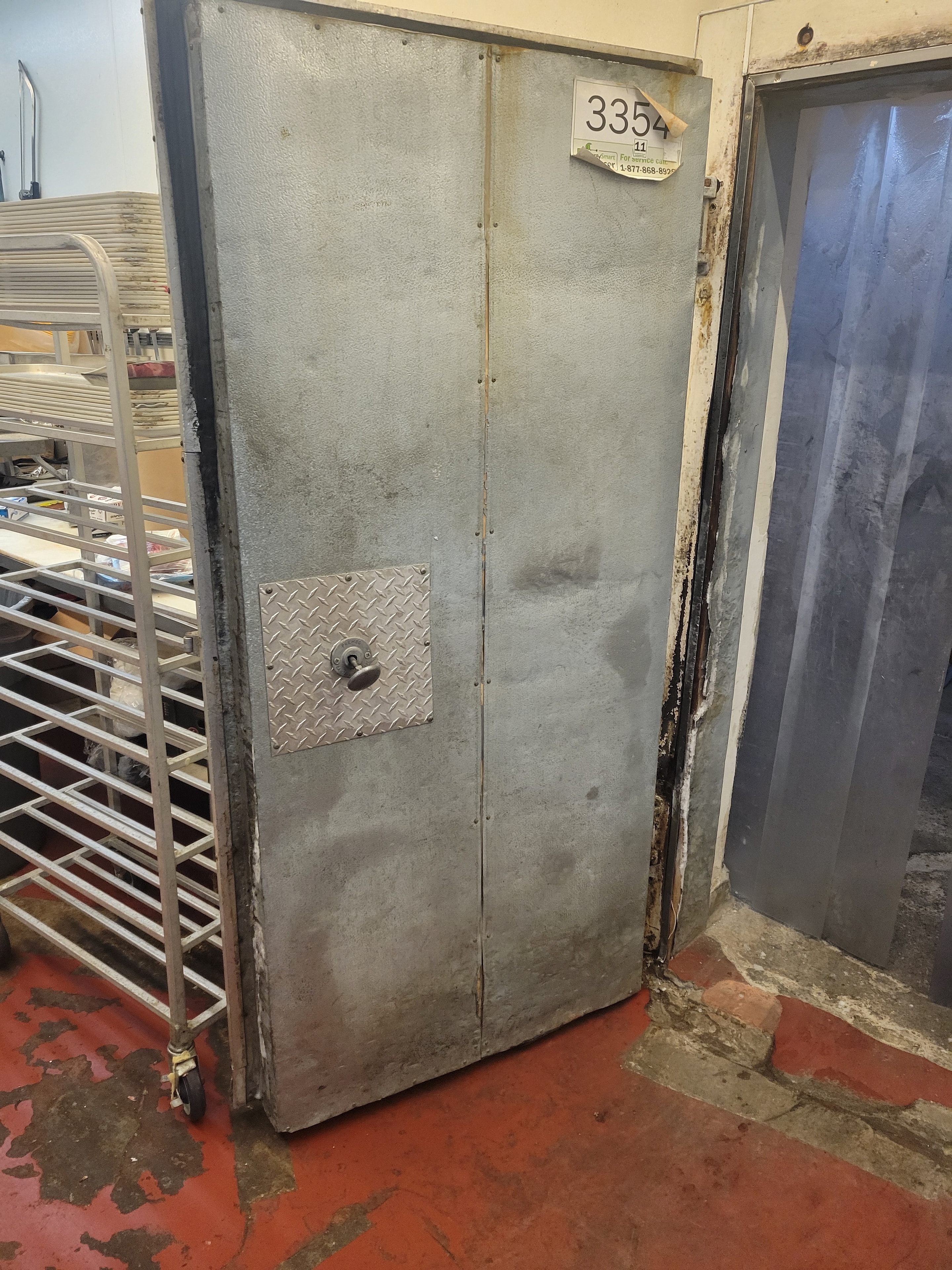 Old walk-in freezer door removed, new panel in place