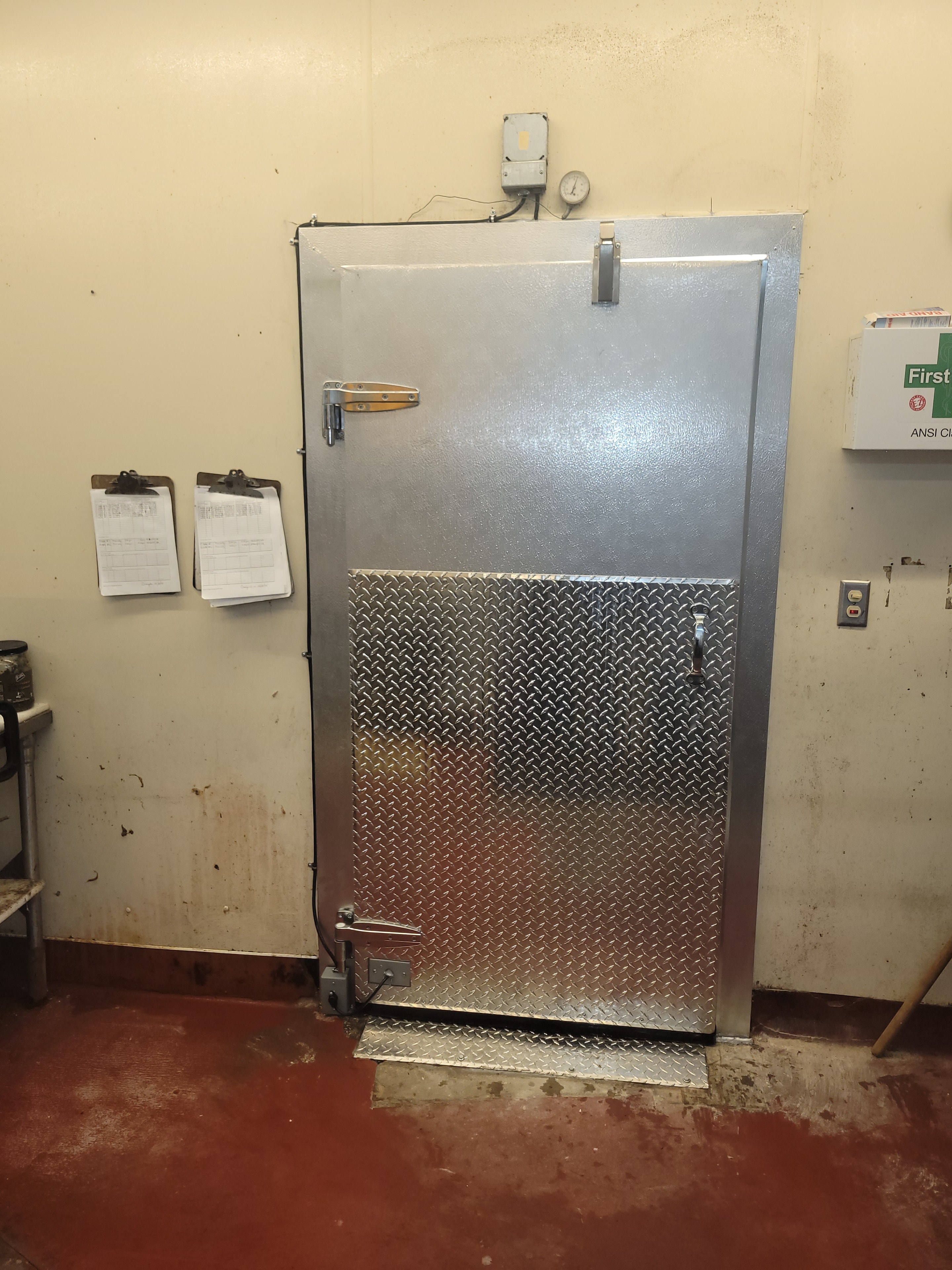 Finished walk-in freezer door with diamond-plate panel