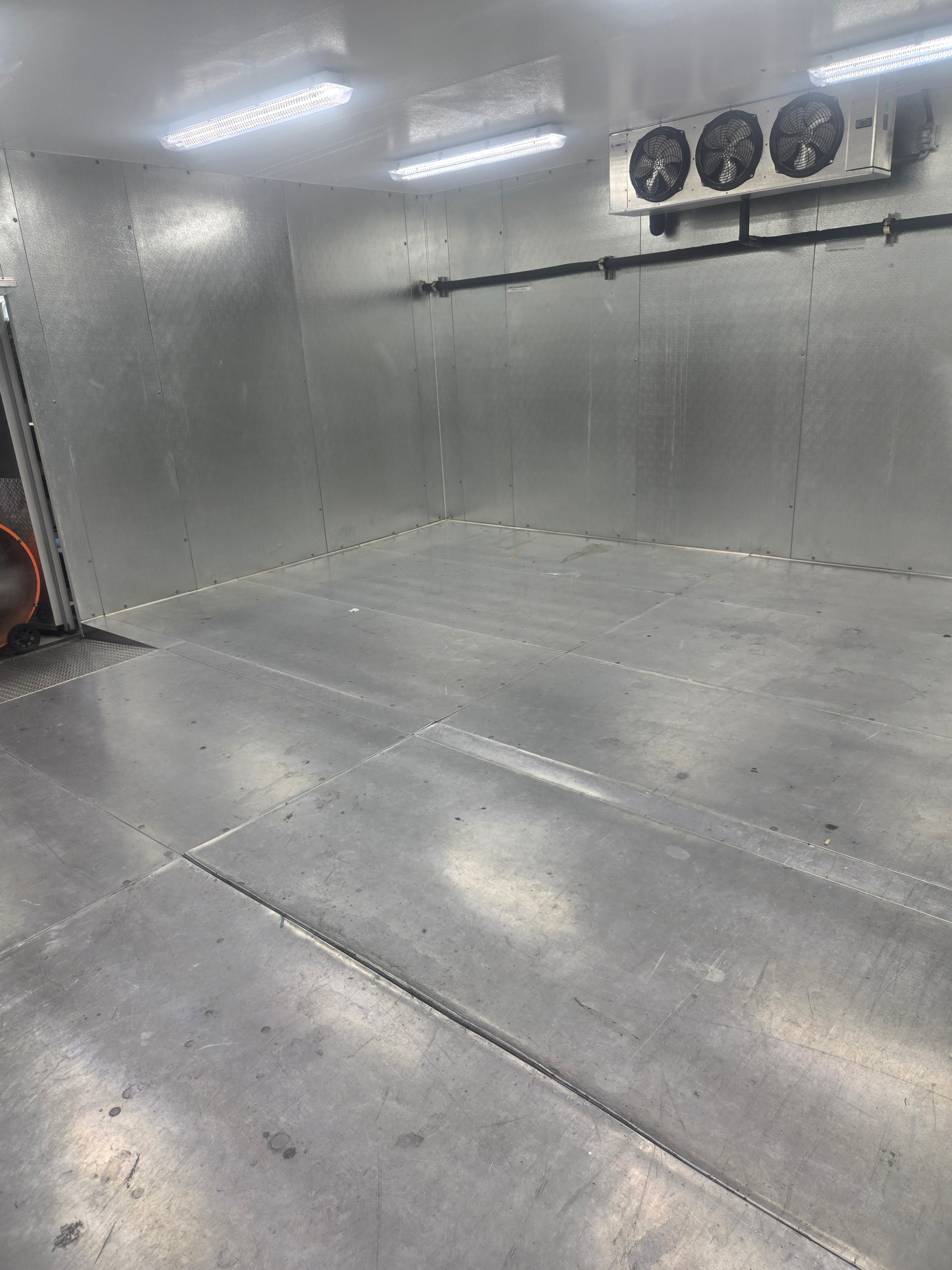 Walk-in freezer floor during repair preparation