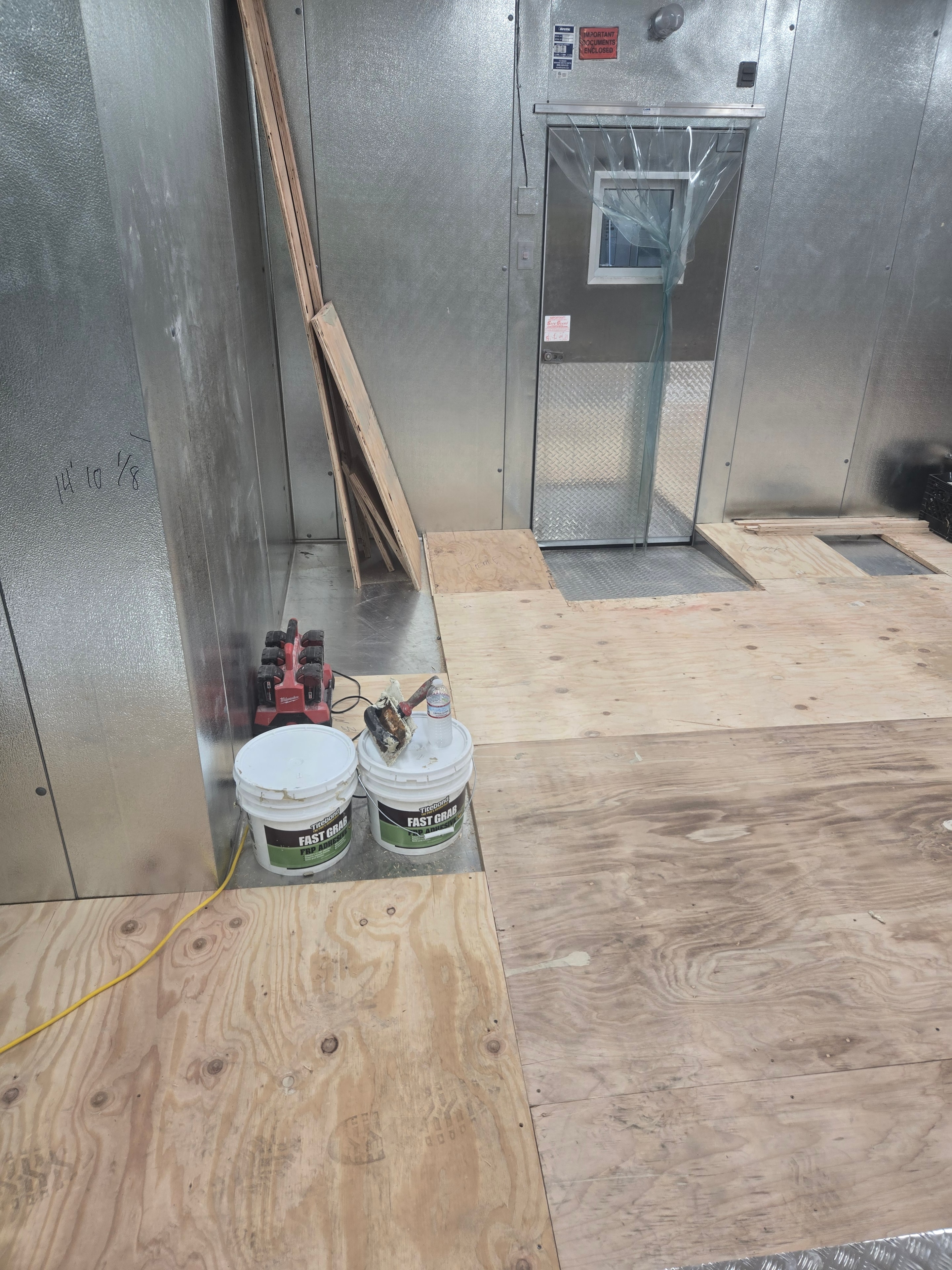 Walk-in freezer floor with new plywood subfloor installed